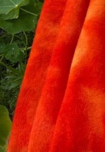 This hand-dyed orange-red poppy colour is a mix of orange and red, that resembles a warm and intense hue similar to that of a sunset or a springtime poppy. This is a beautifully hand-dyed wool that showcases a single color but boasts a captivating range of values within that hue.
