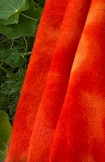 This hand-dyed orange-red poppy colour is a mix of orange and red, that resembles a warm and intense hue similar to that of a sunset or a springtime poppy. This is a beautifully hand-dyed wool that showcases a single color but boasts a captivating range of values within that hue.